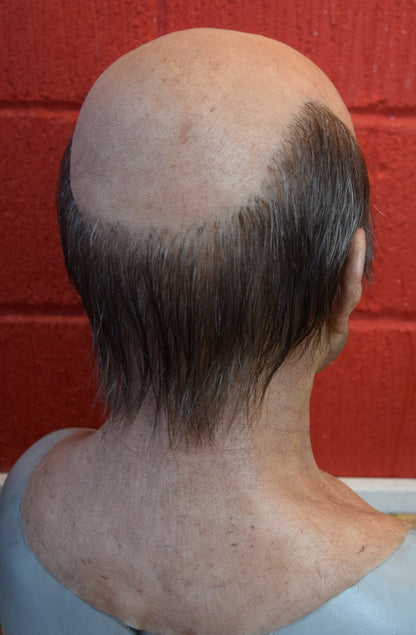 Stan old man with hand punched eyebrows, mustache and a horseshoe of hair