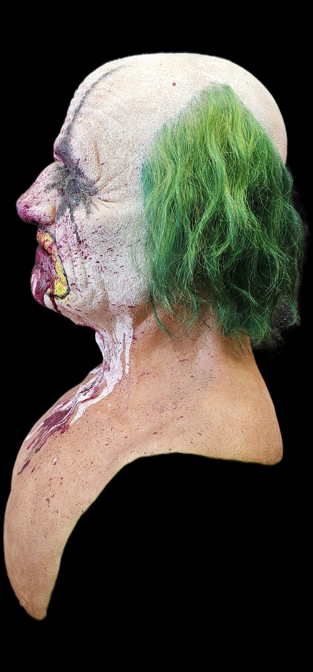 Zombie head with green hair on a black background
